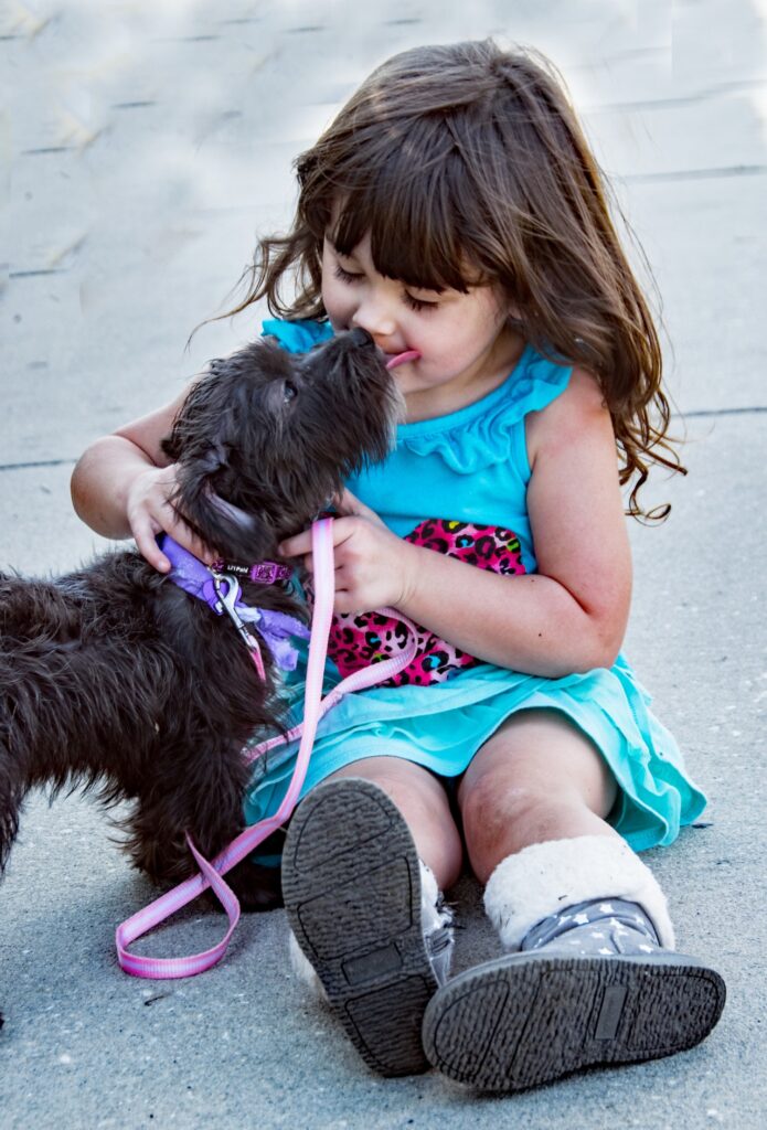 Dog with little girl - The Ranch Pet Resort